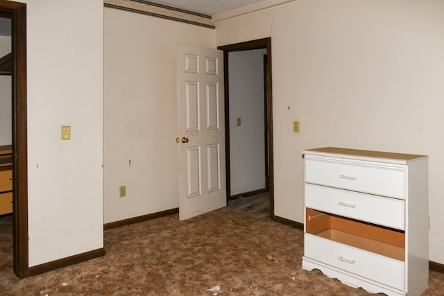 unfurnished bedroom featuring dark colored carpet