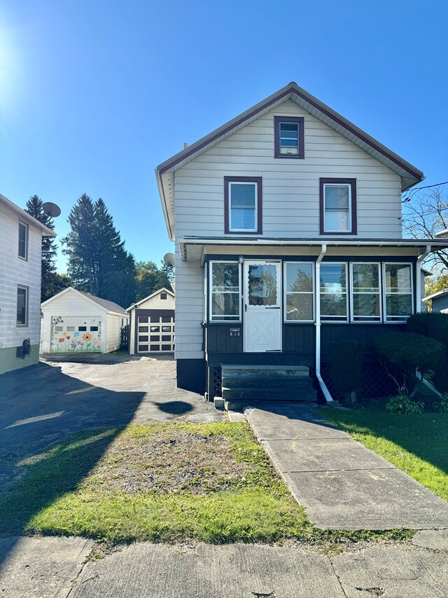 view of front of property with an outbuilding and a garage