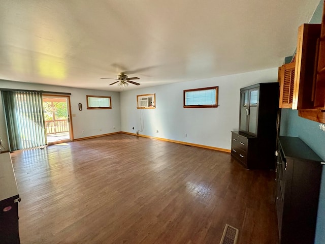 unfurnished living room with wood-type flooring and ceiling fan