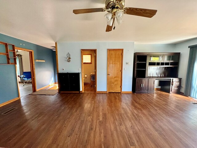 unfurnished living room featuring wood-type flooring and ceiling fan