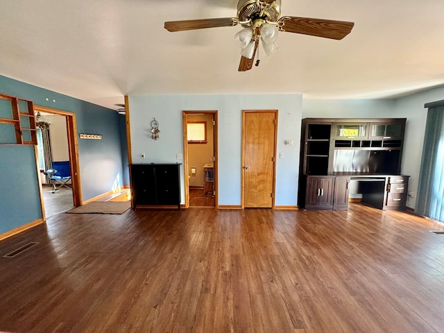 unfurnished living room featuring hardwood / wood-style floors and ceiling fan