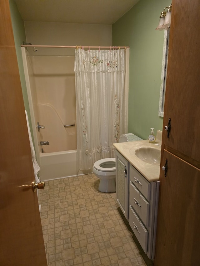 full bathroom with shower / bath combo, vanity, and toilet