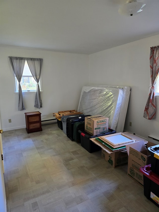 storage area featuring baseboard heating