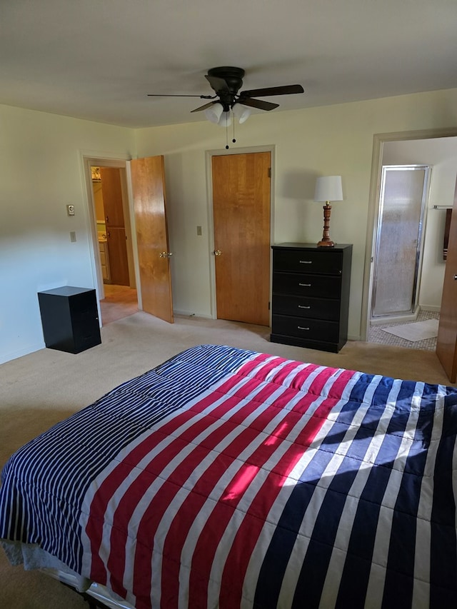 bedroom with carpet, ceiling fan, and ensuite bath