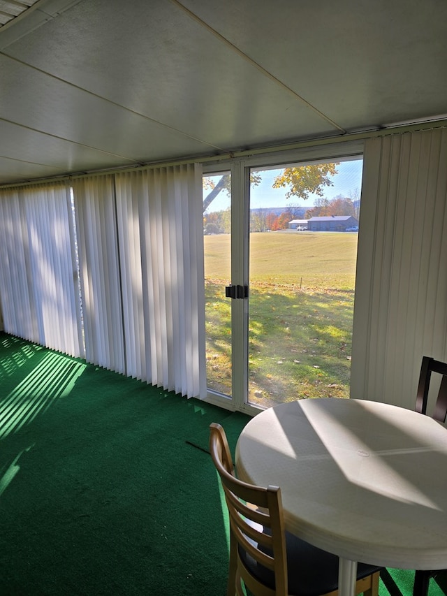 sunroom / solarium featuring a rural view