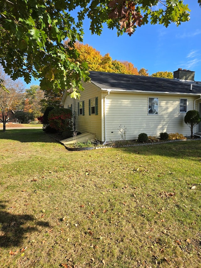 view of property exterior with a lawn