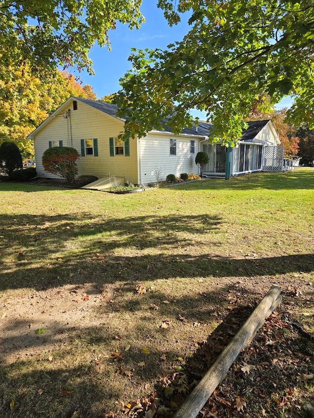 view of yard with a sunroom