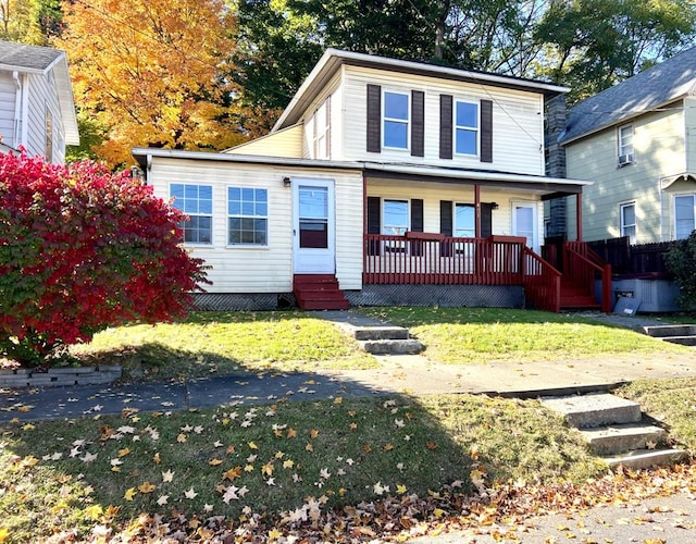 view of front of house with a front lawn and covered porch