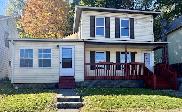 front facade with a front yard and a porch