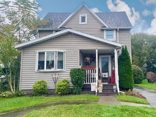 view of front facade with a porch and a front lawn