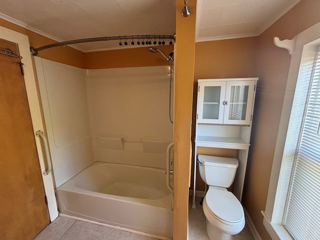 bathroom featuring crown molding, shower / tub combination, tile patterned floors, and toilet