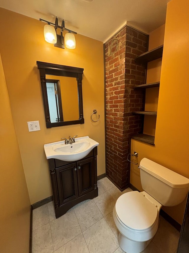 bathroom with tile patterned floors, vanity, and toilet