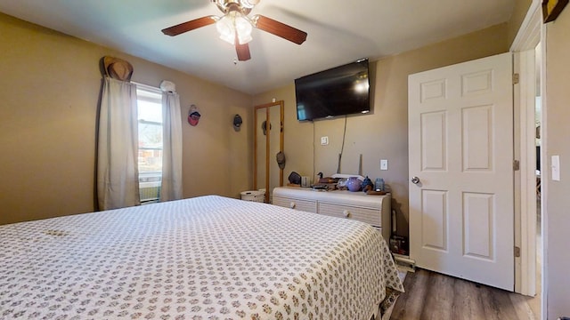 bedroom featuring ceiling fan and wood-type flooring