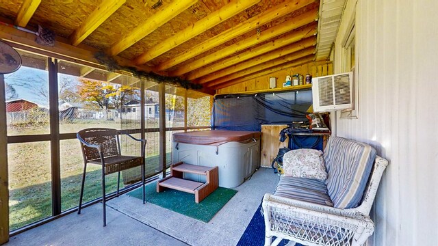 sunroom / solarium featuring vaulted ceiling