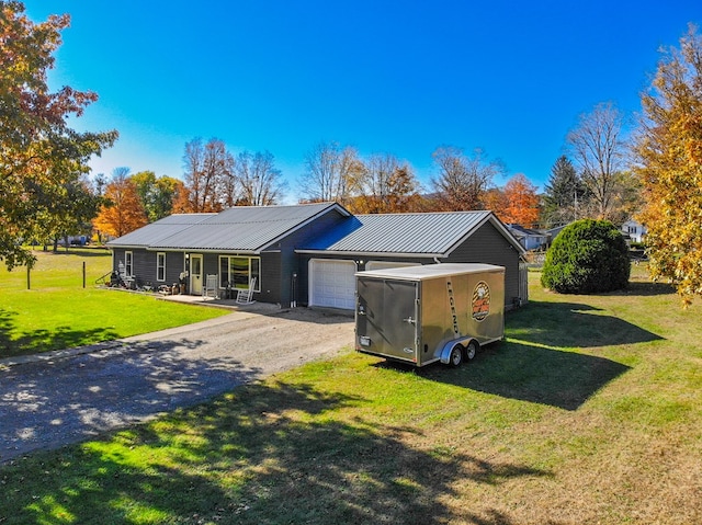 view of front of property featuring a garage and a front yard