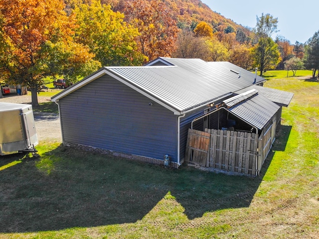 exterior space with a mountain view and a yard