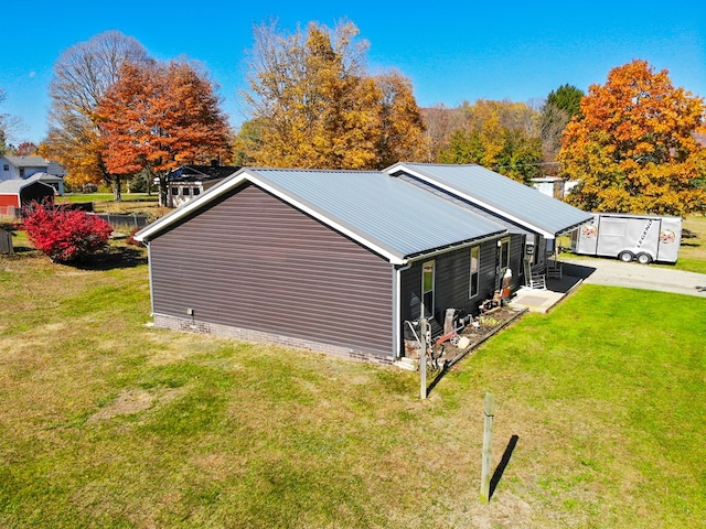 view of home's exterior featuring a lawn