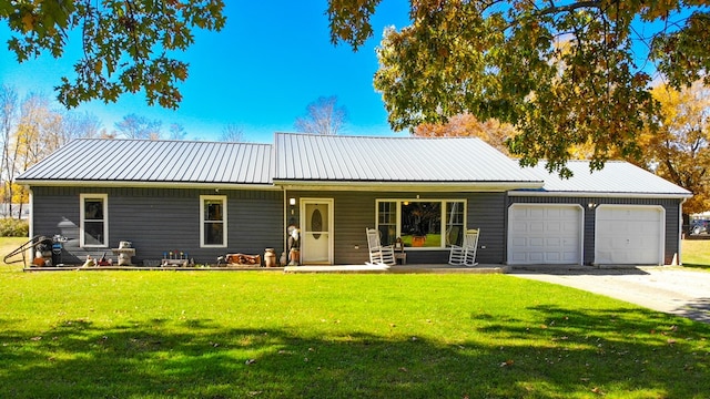 view of front of home with a front lawn, a porch, and a garage