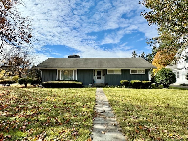 ranch-style home featuring a front yard