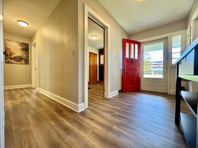 entryway with hardwood / wood-style floors