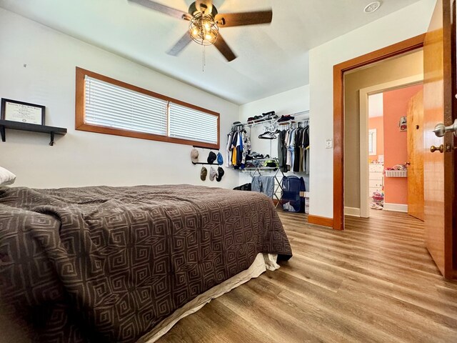 bedroom featuring light hardwood / wood-style flooring and ceiling fan