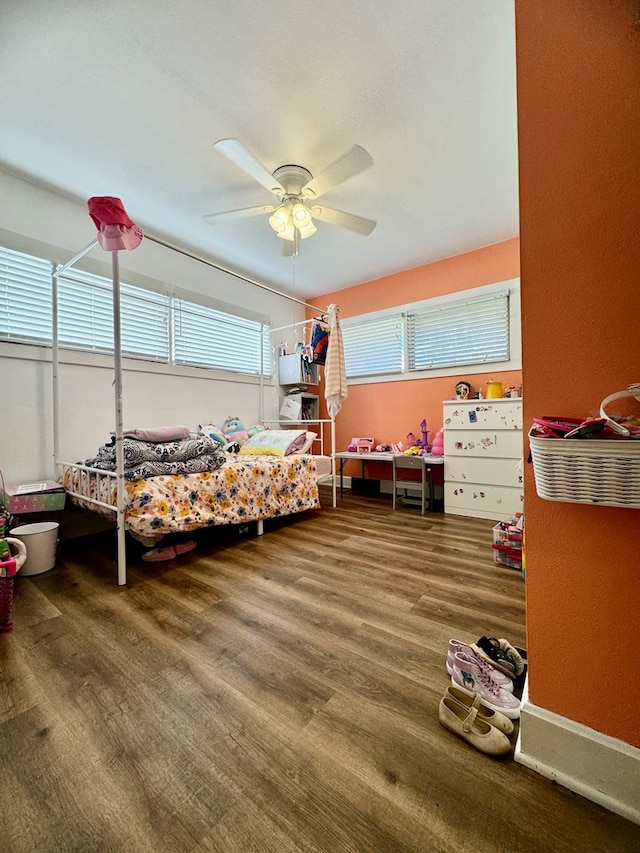 bedroom featuring ceiling fan and wood-type flooring