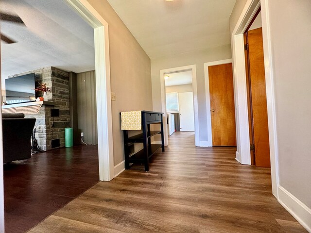 hallway featuring dark hardwood / wood-style flooring