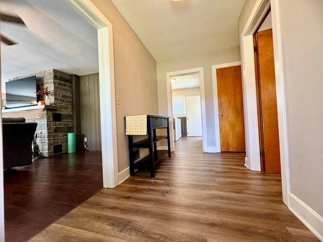 hall featuring dark wood-type flooring