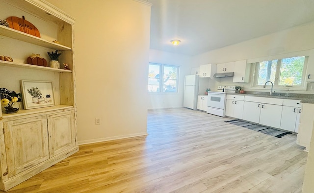 kitchen featuring light hardwood / wood-style floors, a healthy amount of sunlight, white appliances, and sink