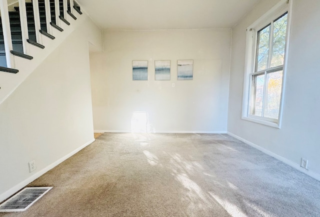 unfurnished living room with carpet