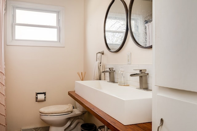 bathroom with toilet and sink