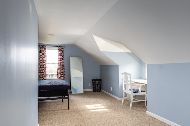 carpeted bedroom featuring lofted ceiling