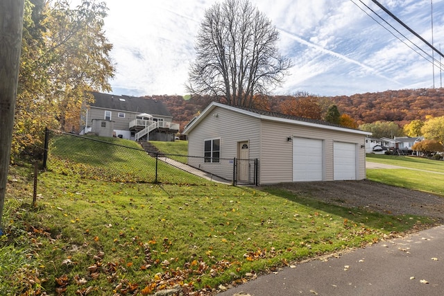 garage featuring a yard