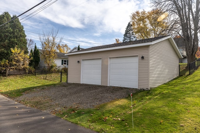 garage with a yard