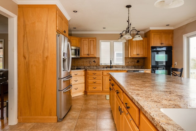 kitchen featuring decorative backsplash, appliances with stainless steel finishes, plenty of natural light, and ornamental molding