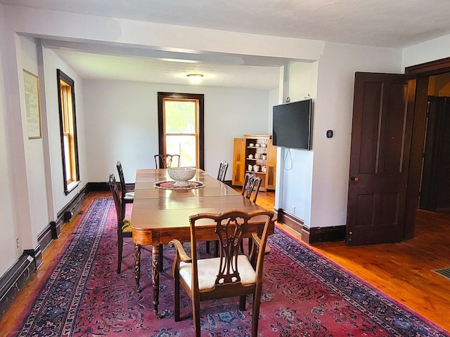 dining area with hardwood / wood-style flooring