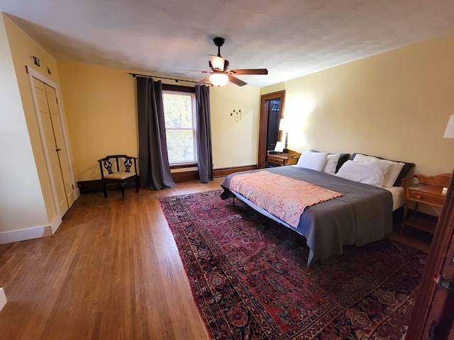 bedroom featuring hardwood / wood-style flooring and ceiling fan