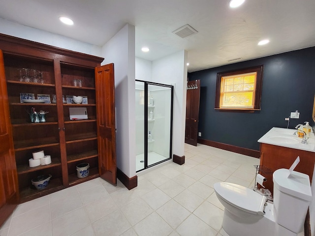 bathroom featuring a shower with door, vanity, and toilet