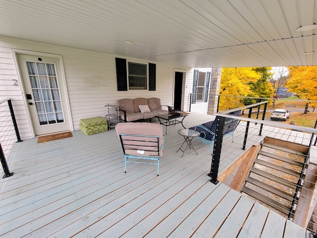 wooden deck featuring outdoor lounge area