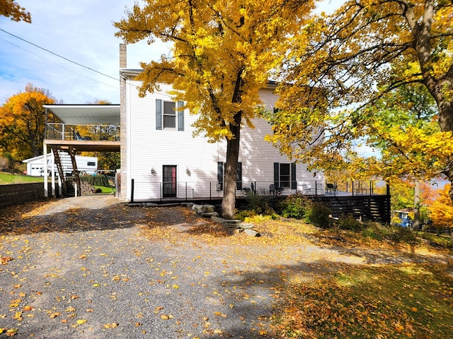 view of property exterior with a carport