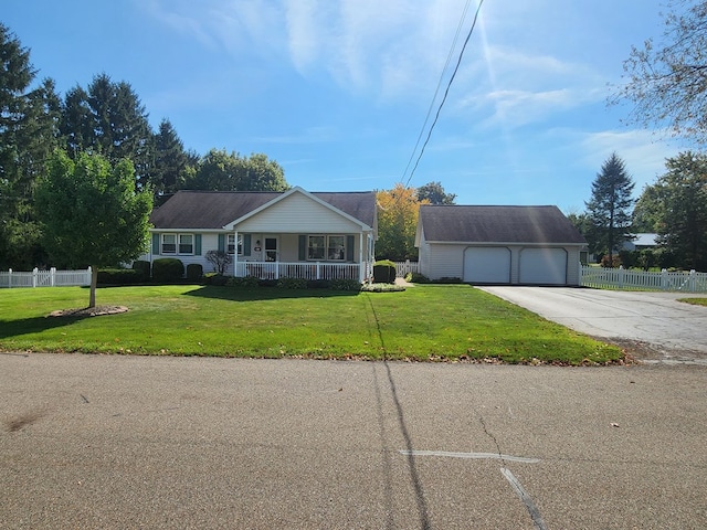 ranch-style home featuring covered porch and a front lawn