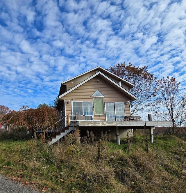 view of front of house with a wooden deck