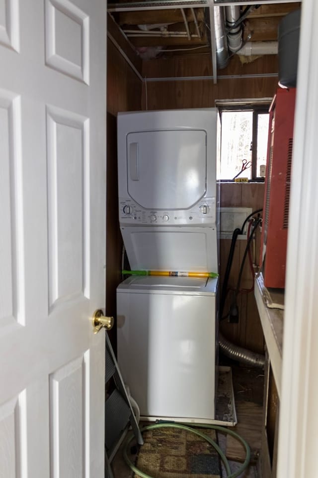 clothes washing area with stacked washer / drying machine