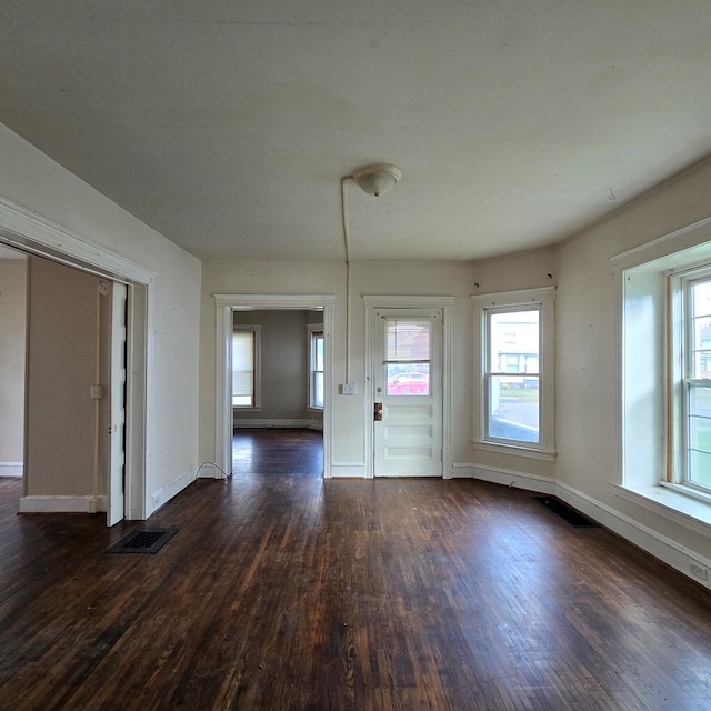 unfurnished room featuring dark hardwood / wood-style flooring