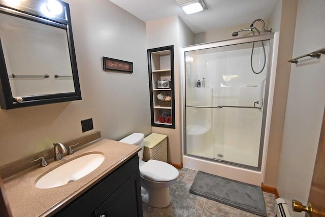 bathroom featuring vanity, a baseboard radiator, a shower with door, and toilet