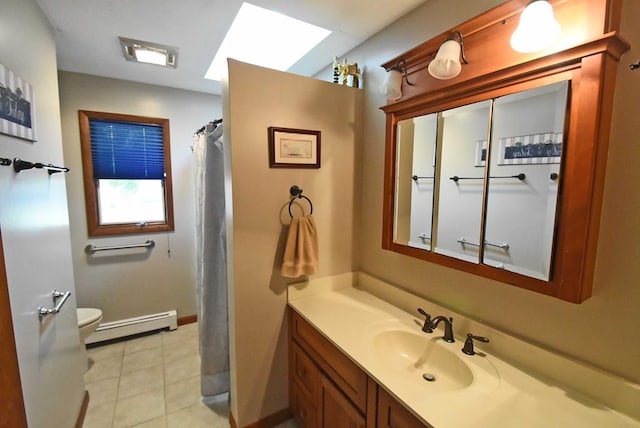 bathroom with tile patterned flooring, vanity, baseboard heating, and toilet