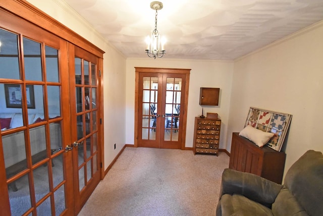 living area with an inviting chandelier, crown molding, carpet floors, and french doors