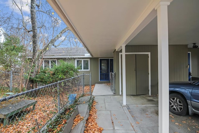 exterior space featuring a carport