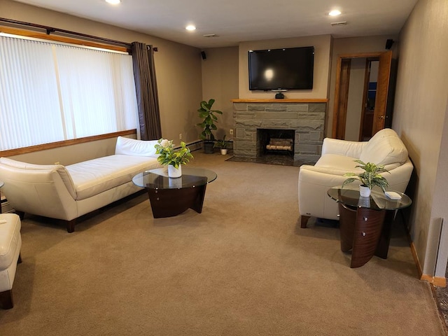 living room featuring light colored carpet and a fireplace