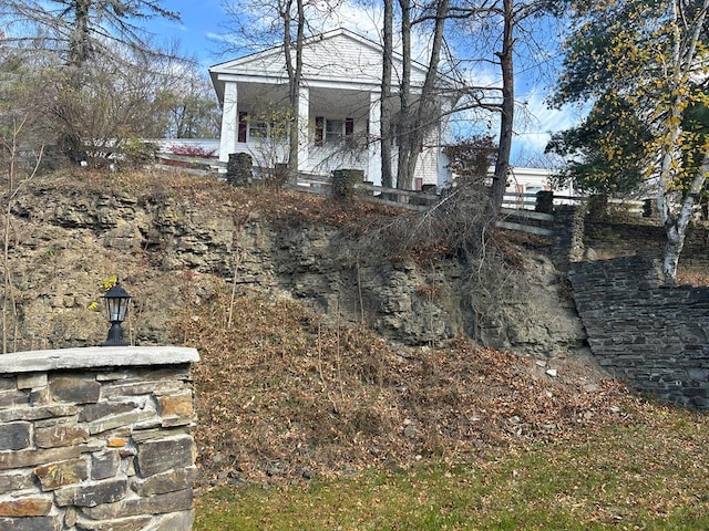 view of yard featuring covered porch